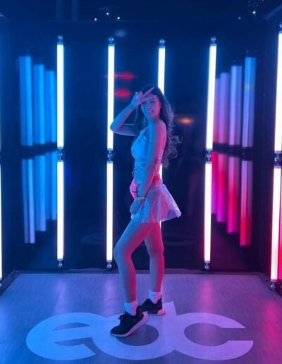 Binh enjoying a vibrant night at EDC in Tokyo wearing a chic outfit - Tokyo Escorts.